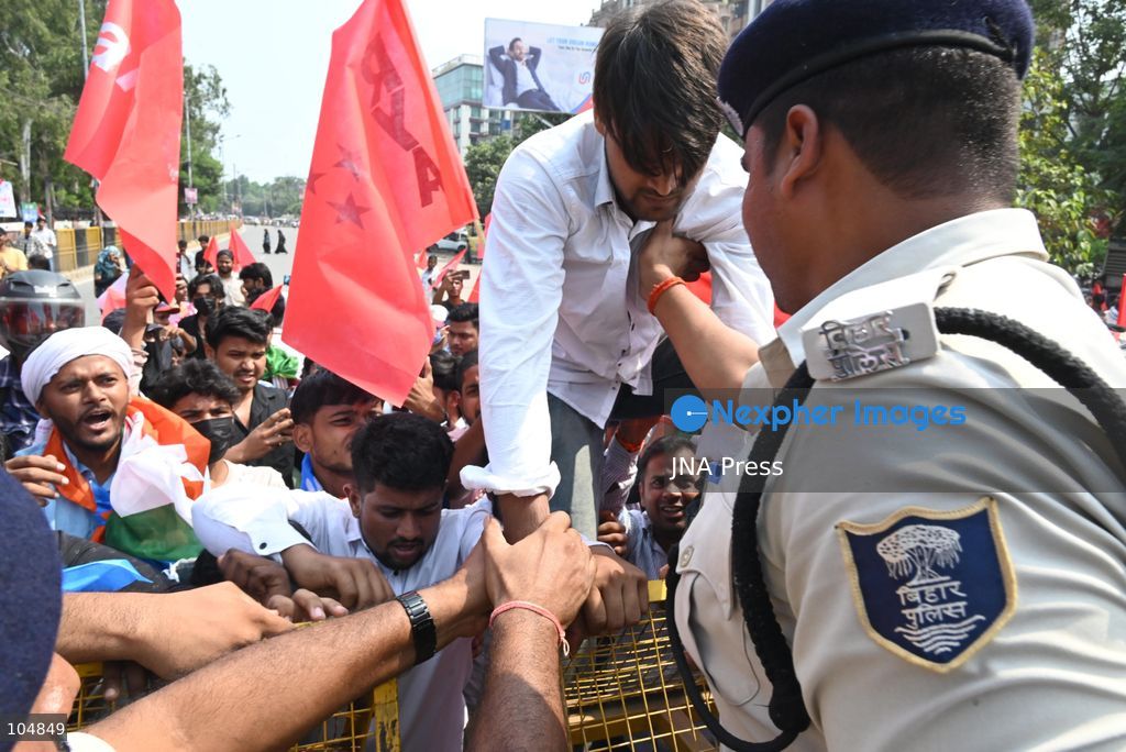 PATNA, INDIA, OCTOBER 13, 2026: Police detain students of the All India Students’ Association (AISA), who took out a protest march toward Lok Bhavan, formerly Raj Bhavan, at JP roundabout in Patna, demanding the resignation of Chief Election Commissioner Gyanesh Kumar and the cancellation or review of the Special Intensive Revision (SIR) of electoral rolls. Photo by Rahul Sharma / JNA Press (Photo by Rahul Sharma/JNA Press via Nexpher Images)