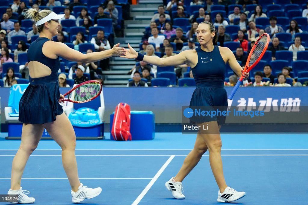 Gabriela Dabrowski of Canada and Luisa Stefani of Brazil defeated Zhang Shuai of China and Katerina Siniakova of the Czech Republic 2-0 in the women's doubles final at the Diamond Court of the National Tennis Center in Beijing, China, on October 11, 2026. Stefani (R) and Dabrowski are seen discussing their serving tactics. (Photo by Peter Li/Nexpher Images)