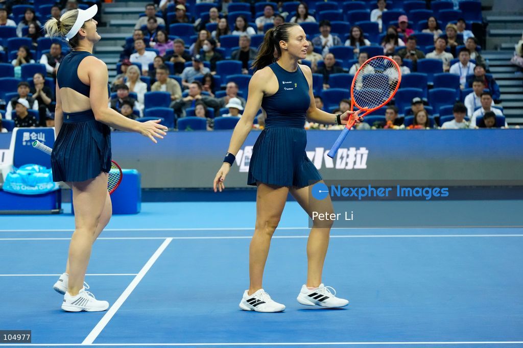 Gabriela Dabrowski of Canada and Luisa Stefani of Brazil defeated Zhang Shuai of China and Katerina Siniakova of the Czech Republic 2-0 in the women's doubles final at the Diamond Court of the National Tennis Center in Beijing, China, on October 11, 2026. Stefani (R) and Dabrowski are seen discussing their serving tactics. (Photo by Peter Li/Nexpher Images)