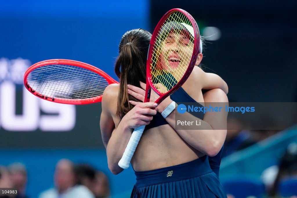 Gabriela Dabrowski of Canada and Luisa Stefani of Brazil celebrates winning against Zhang Shuai of China and Katerina Siniakova of the Czech Republic 2-0 in the women's doubles final at the Diamond Court of the National Tennis Center in Beijing, China, on October 11, 2026. Stefani (R) and Dabrowski are seen discussing their serving tactics. (Photo by Peter Li/Nexpher Images)