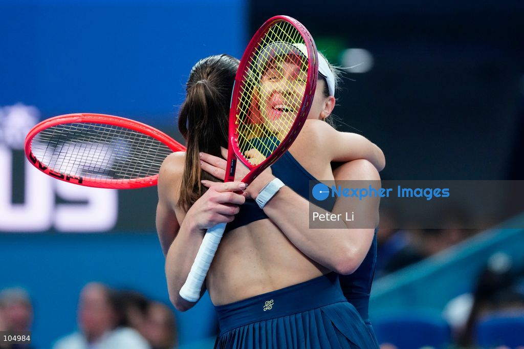 Gabriela Dabrowski of Canada and Luisa Stefani of Brazil celebrates winning against Zhang Shuai of China and Katerina Siniakova of the Czech Republic 2-0 in the women's doubles final at the Diamond Court of the National Tennis Center in Beijing, China, on October 11, 2026. Stefani (R) and Dabrowski are seen discussing their serving tactics. (Photo by Peter Li/Nexpher Images)