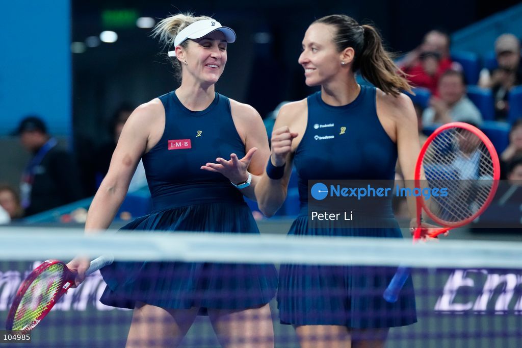 Gabriela Dabrowski of Canada and Luisa Stefani of Brazil celebrates winning against Zhang Shuai of China and Katerina Siniakova of the Czech Republic 2-0 in the women's doubles final at the Diamond Court of the National Tennis Center in Beijing, China, on October 11, 2026. Stefani (R) and Dabrowski are seen discussing their serving tactics. (Photo by Peter Li/Nexpher Images)