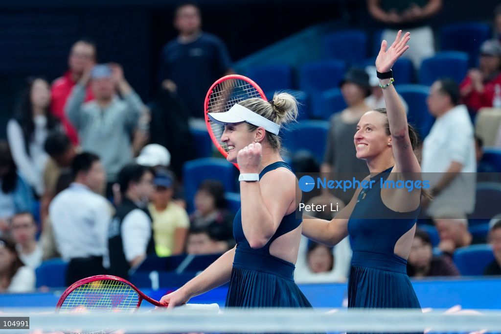 Gabriela Dabrowski of Canada and Luisa Stefani of Brazil celebrates winning against Zhang Shuai of China and Katerina Siniakova of the Czech Republic 2-0 in the women's doubles final at the Diamond Court of the National Tennis Center in Beijing, China, on October 11, 2026. Stefani (R) and Dabrowski are seen discussing their serving tactics. (Photo by Peter Li/Nexpher Images)