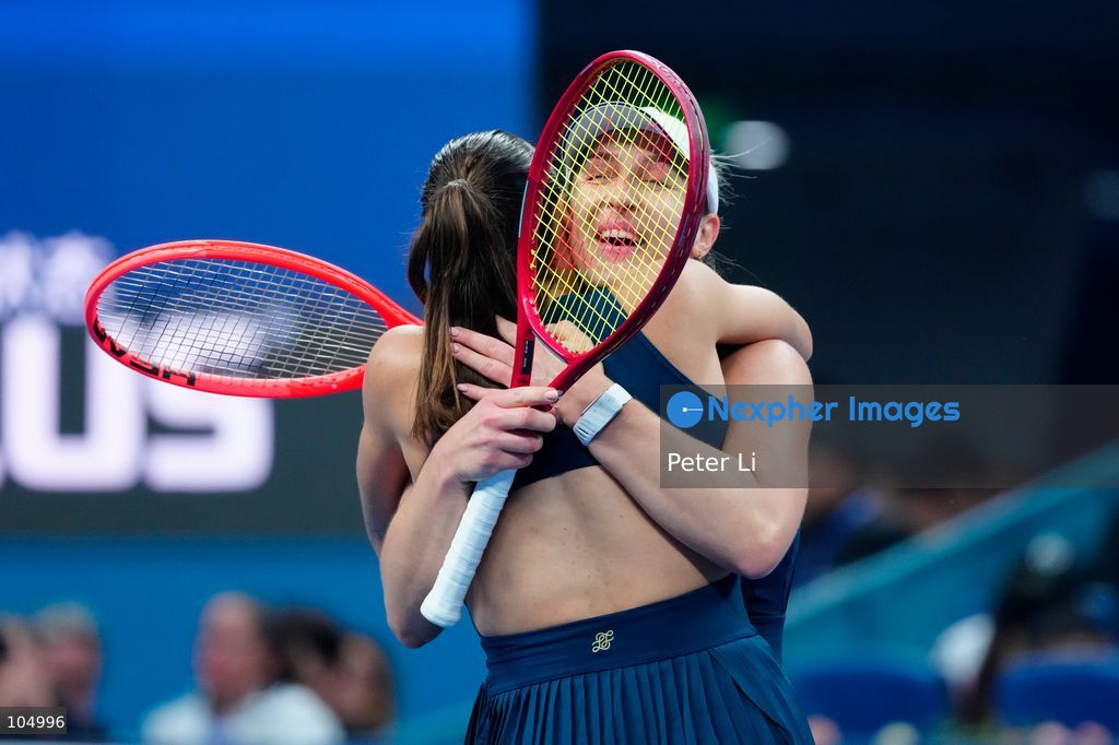 Gabriela Dabrowski of Canada and Luisa Stefani of Brazil celebrates winning against Zhang Shuai of China and Katerina Siniakova of the Czech Republic 2-0 in the women's doubles final at the Diamond Court of the National Tennis Center in Beijing, China, on October 11, 2026. Stefani (R) and Dabrowski are seen discussing their serving tactics. (Photo by Peter Li/Nexpher Images)