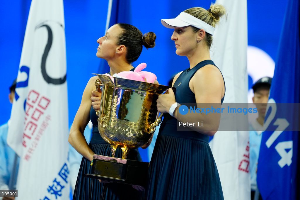 Gabriela Dabrowski of Canada and Luisa Stefani of Brazil celebrates winning against Zhang Shuai of China and Katerina Siniakova of the Czech Republic 2-0 in the women's doubles final at the Diamond Court of the National Tennis Center in Beijing, China, on October 11, 2026. Stefani (R) and Dabrowski are seen discussing their serving tactics. (Photo by Peter Li/Nexpher Images)