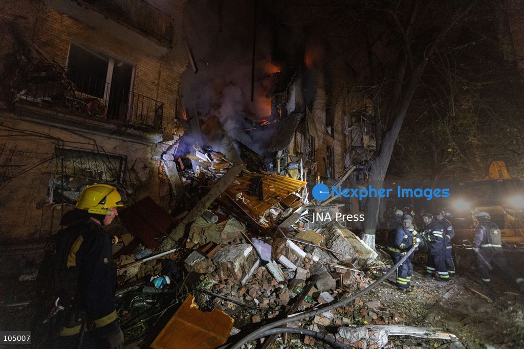 TOP PICS - KHARKIV, UKRAINE, OCTOBER 12, 2026: Emergency workers conduct rescue operations at a residential building damaged in a Russian strike in Kharkiv's Kholodnohirskyi district. A firefighter was injured by falling concrete debris while clearing the rubble and was evacuated on a stretcher. Photo by Andrew Cling/ JNA Press. (Photo by Andrew Cling/JNA Press via Nexpher Images)