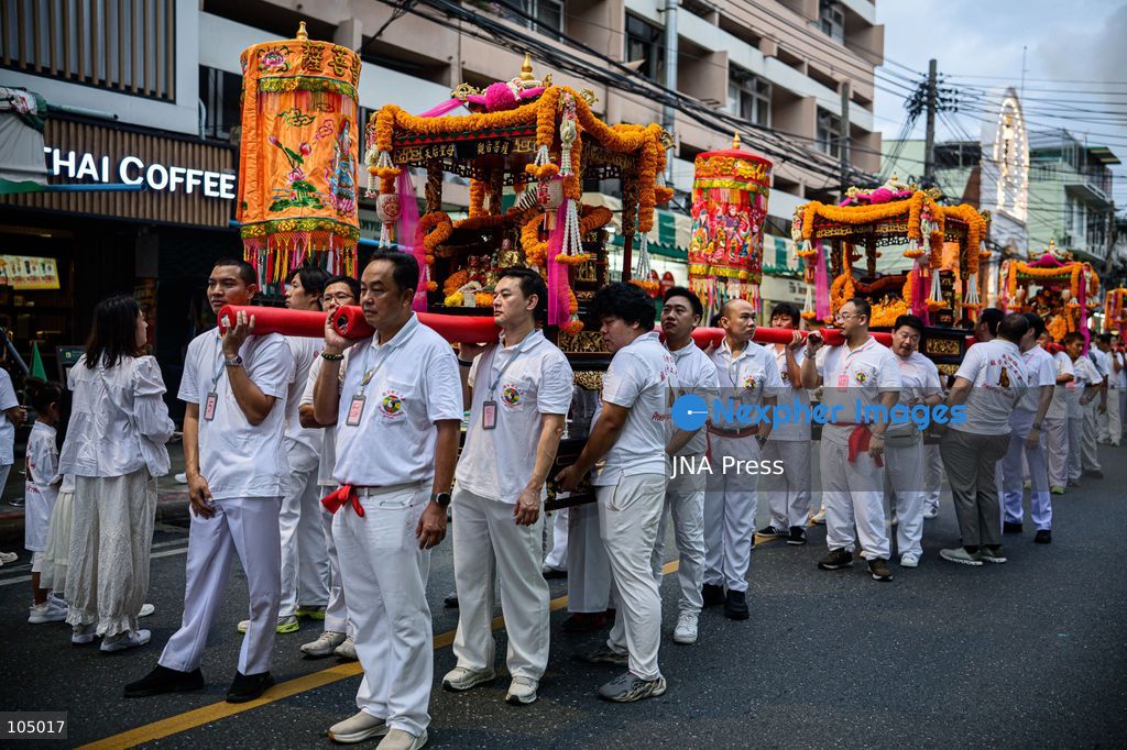 TOP PICS - BANGKOK, THAILAND, OCTOBER 11, 2026: Devotees and performers take part in the annual deity procession organized by the Tiger God Shrine in Bangkok. The celebration features Chinese religious traditions including a procession of deities, Yingge performances, lion dances and dragon dances, as worshippers gather to pay respects and seek blessings. According to the shrine's tradition, the annual observance commemorates the day Tua Lao Eia Kong attained spiritual enlightenment. Photo by Watsawat Koktabtim / JNA Press. (Photo by Watsawat "James" Koktabtim/JNA Press via Nexpher Images)