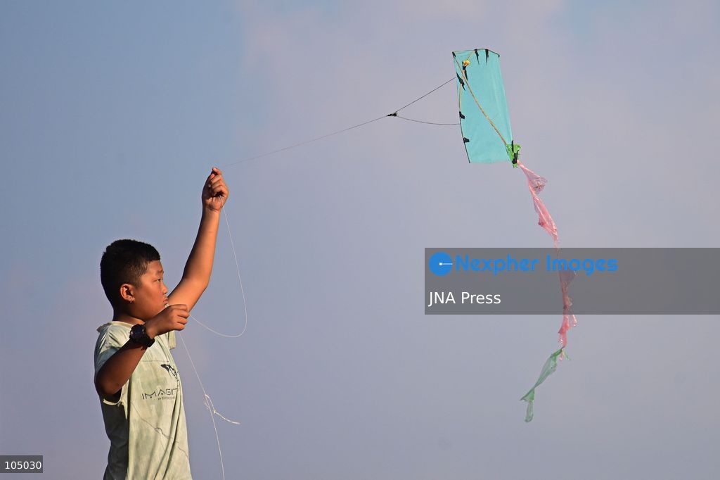 KATHMANDU, NEPAL, OCTOBER 13, 2026: A child flies a kite during the Dashain festival in Kathmandu, Nepal. Dashain, Nepal’s biggest Hindu festival, is celebrated over 15 days and commemorates the victory of good over evil, with devotees worshipping Goddess Durga. Kite flying is a popular tradition during Dashain, as the festival coincides with the arrival of autumn, when clearer skies and favorable winds provide ideal conditions. According to popular belief, flying kites high into the sky conveys a message to Indra, the Hindu god of rain, that the monsoon rains are no longer needed. The tradition is also associated with seasonal change, outdoor recreation and bringing families and communities together during the festive period. Photo by Safal Prakash Shrestha / JNA Press (Photo by Safal Prakash Shrestha/JNA Press via Nexpher Images)