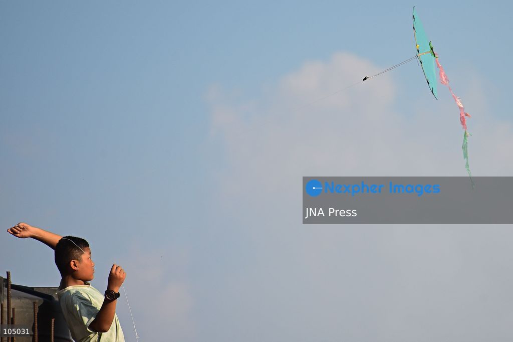 KATHMANDU, NEPAL, OCTOBER 13, 2026: A child flies a kite during the Dashain festival in Kathmandu, Nepal. Dashain, Nepal’s biggest Hindu festival, is celebrated over 15 days and commemorates the victory of good over evil, with devotees worshipping Goddess Durga. Kite flying is a popular tradition during Dashain, as the festival coincides with the arrival of autumn, when clearer skies and favorable winds provide ideal conditions. According to popular belief, flying kites high into the sky conveys a message to Indra, the Hindu god of rain, that the monsoon rains are no longer needed. The tradition is also associated with seasonal change, outdoor recreation and bringing families and communities together during the festive period. Photo by Safal Prakash Shrestha / JNA Press (Photo by Safal Prakash Shrestha/JNA Press via Nexpher Images)