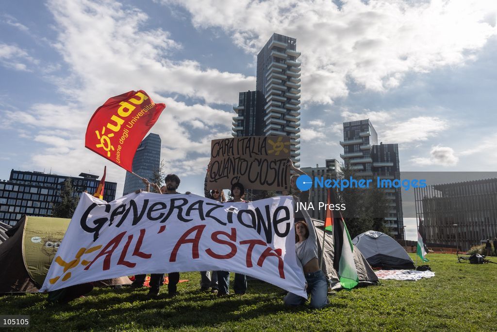 MILAN, ITALY, OCTOBER 12, 2026: A small group of roughly ten student activists gathers outside the COIMA headquarters, near the Bosco Verticale (Vertical Forest), to protest the high cost of living, soaring housing prices and the commodification of education. Organized by student groups UDU Milano and UDU Statale, the demonstration highlights the steep deficit in affordable student housing, noting that Milan hosts roughly 100,000 out-of-town students but offers fewer than 16,000 public university residential beds. Banners at the protest read ‘Generazione all’Asta’ (Generation at Auction) and ‘Cara Italia quanto ci costi’ (Dear Italy, how much you cost us), demanding immediate public funding for transport, public services and the fundamental right to study. Photo by Nadia Caimi / JNA Press (Photo by Nadia Caimi/JNA Press via Nexpher Images)