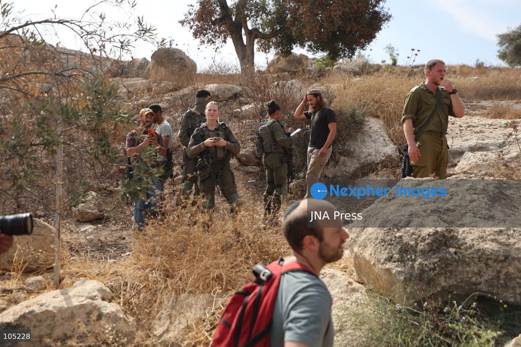 IDHNA, WEST BANK, PALESTINE, OCTOBER 13, 2026: Israeli soldiers and settlers prevent Palestinians and activists from harvesting olives in Idhna, west of Hebron, in the occupied West Bank. Israeli forces order the harvesters and activists to leave the area. Photo by Mosab Shawer / JNA Press. (Photo by Mosab shawer/JNA Press via Nexpher Images)