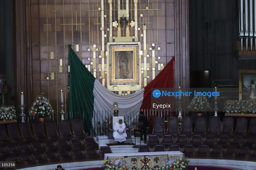 The sacred tilma (cloak) bearing the image of Our Lady of Guadalupe, is seen behind the main altar inside the Basilica of Our Lady of Guadalupe during the commemoration of the 50th anniversary of the dedication and opening of the New Basilica on October 12, 2026 in Mexico City, Mexico. The modern circular sanctuary, designed by architect Pedro Ramírez Vázquez, was inaugurated on October 12, 1976, to safely house the sacred cloak of the Virgin of Guadalupe. (Photo by Carlos Santiago/ Eyepix Group) (Photo by Carlos Santiago/ Eyepix Group/Eyepix via Nexpher Images)