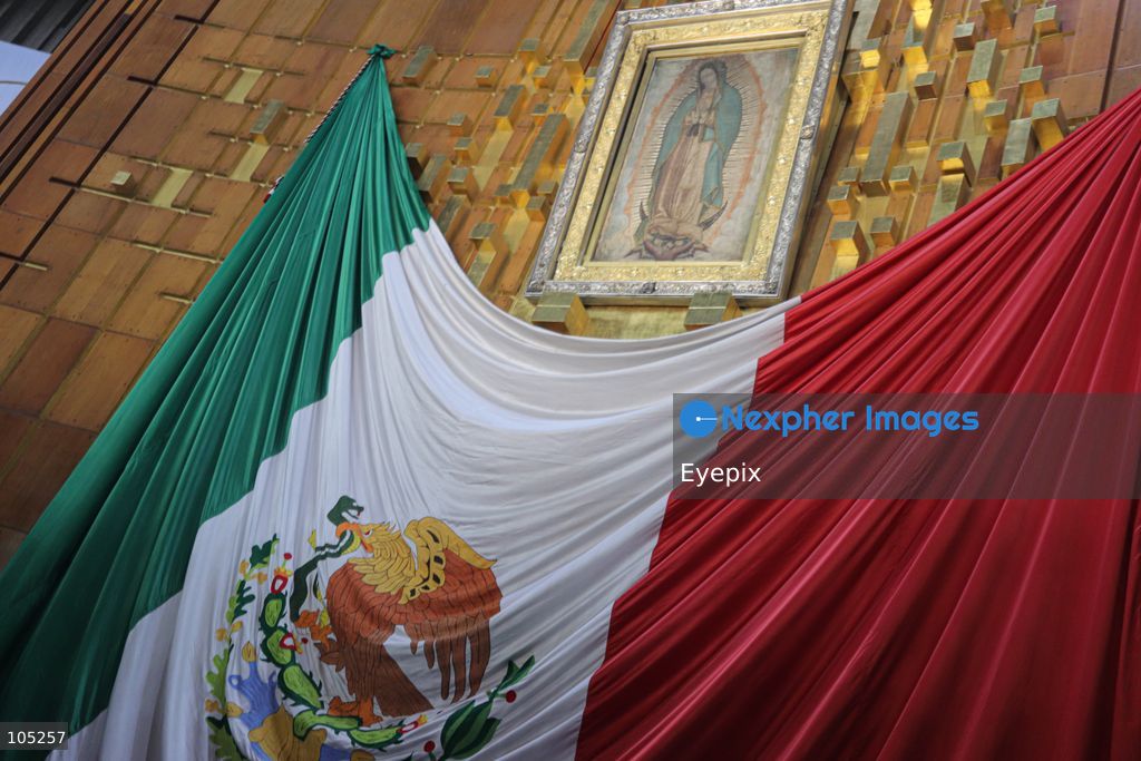 A low-angle view of the official replica of the sacred image of Our Lady of Guadalupe , is seen inside the Basilica of Our Lady of Guadalupe during the commemoration of the 50th anniversary of the dedication and opening of the New Basilica on October 12, 2026 in Mexico City, Mexico. The modern circular sanctuary, designed by architect Pedro Ramírez Vázquez, was inaugurated on October 12, 1976, to safely house the sacred cloak of the Virgin of Guadalupe. (Photo by Carlos Santiago/ Eyepix Group) (Photo by Carlos Santiago/ Eyepix Group/Eyepix via Nexpher Images)