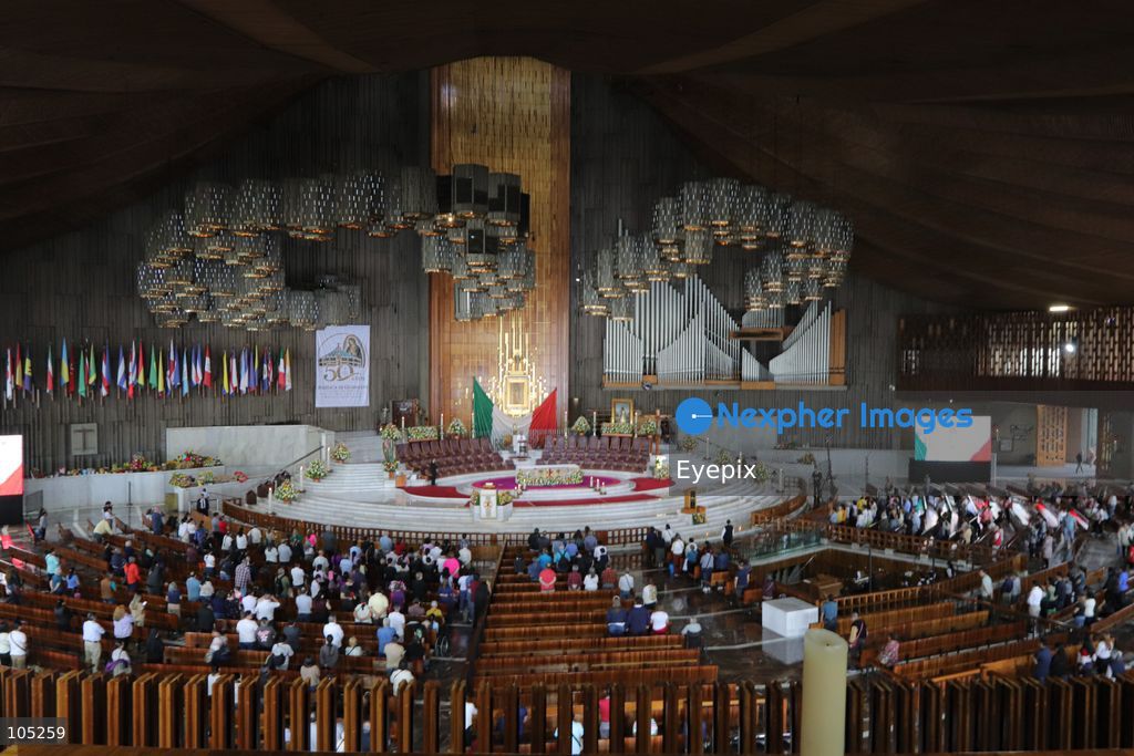 People gather the Basilica of Our Lady of Guadalupe during the commemoration of the 50th anniversary of the dedication and opening of the New Basilica on October 12, 2026 in Mexico City, Mexico. The modern circular sanctuary, designed by architect Pedro Ramírez Vázquez, was  inaugurated on October 12, 1976, to safely house the sacred cloak of the Virgin of Guadalupe. (Photo by Carlos Santiago/ Eyepix Group) (Photo by Carlos Santiago/  Eyepix Group/Eyepix via Nexpher Images)