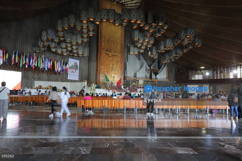 People gather the Basilica of Our Lady of Guadalupe during the commemoration of the 50th anniversary of the dedication and opening of the New Basilica on October 12, 2026 in Mexico City, Mexico. The modern circular sanctuary, designed by architect Pedro Ramírez Vázquez, was inaugurated on October 12, 1976, to safely house the sacred cloak of the Virgin of Guadalupe. (Photo by Carlos Santiago/ Eyepix Group) (Photo by Carlos Santiago/ Eyepix Group/Eyepix via Nexpher Images)