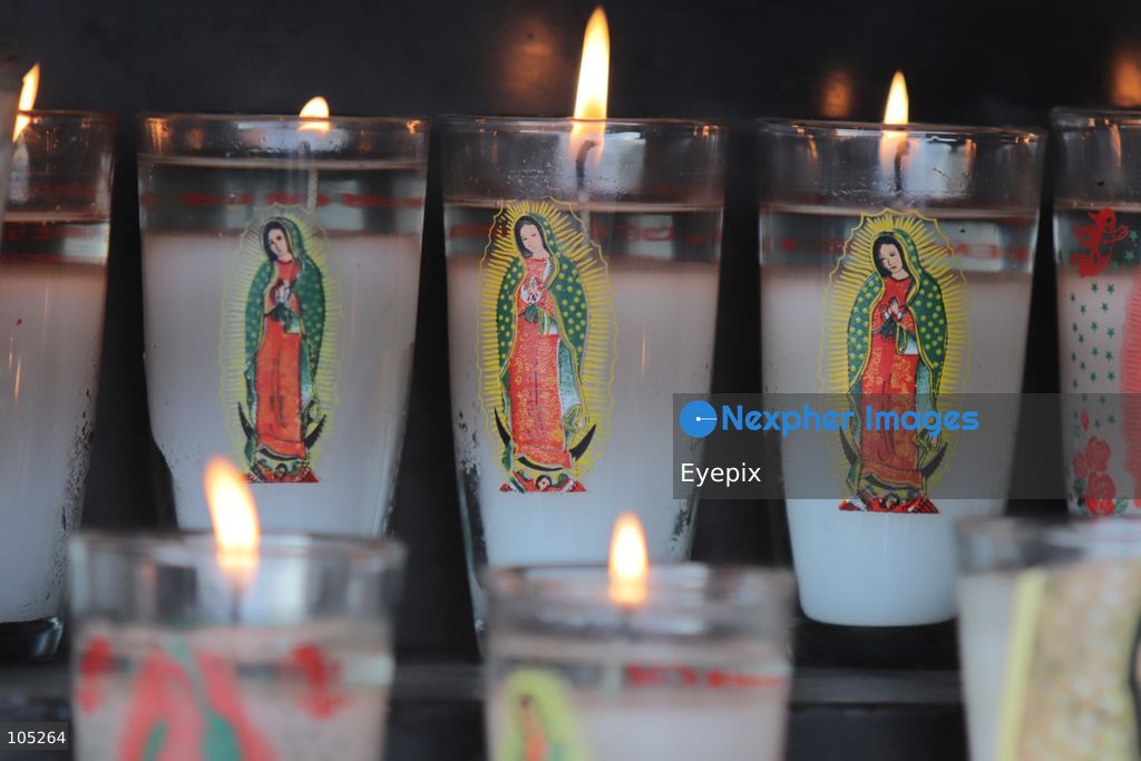 Candles with the image of the Virgin of Guadalupe are seen inside the Basilica of Our Lady of Guadalupe during the commemoration of the 50th anniversary of the dedication and opening of the New Basilica on October 12, 2026 in Mexico City, Mexico. The modern circular sanctuary, designed by architect Pedro Ramírez Vázquez, was inaugurated on October 12, 1976, to safely house the sacred cloak of the Virgin of Guadalupe. (Photo by Carlos Santiago/ Eyepix Group) (Photo by Carlos Santiago/ Eyepix Group/Eyepix via Nexpher Images)