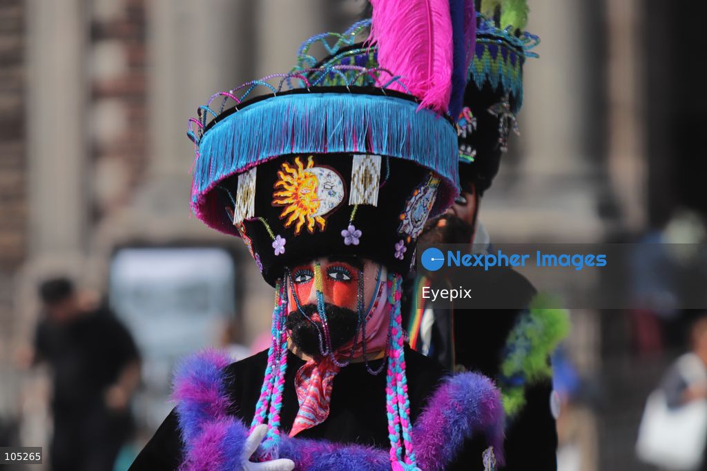 A Pilgrim wearing an elaborate, colorful Chinelo costume stands in the courtyard of the Basilica of Our Lady of Guadalupe during a religious pilgrimage . Faithful from across the country gathered at the national shrine to mark the 50th anniversary of the dedication and opening of the New Basilica, which was inaugurated. on October 12, 2026 in Mexico City, Mexico. (Photo by Carlos Santiago/ Eyepix Group) (Photo by Carlos Santiago/ Eyepix Group/Eyepix via Nexpher Images)