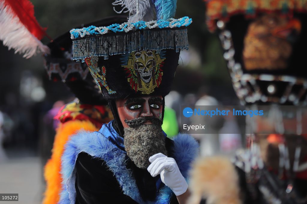 A Pilgrim wearing an elaborate, colorful Chinelo costume stands in the courtyard of the Basilica of Our Lady of Guadalupe during a religious pilgrimage . Faithful from across the country gathered at the national shrine to mark the 50th anniversary of the dedication and opening of the New Basilica, which was inaugurated. on October 12, 2026 in Mexico City, Mexico. (Photo by Carlos Santiago/ Eyepix Group) (Photo by Carlos Santiago/ Eyepix Group/Eyepix via Nexpher Images)