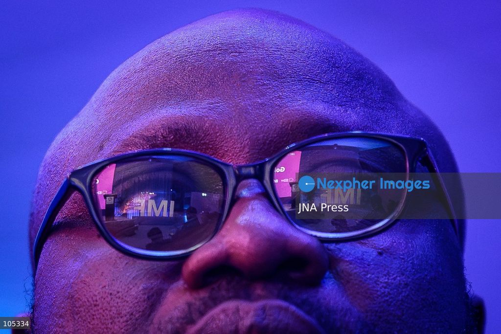 BANGKOK, THAILAND - OCTOBER 13, 2026: Man's glasses' reflection of "IMF" sign as Deputy Managing Director of International Monetary Fund (IMF) Bo Li, Africanews Reporter Afolake Oyinloye, President of African Development Bank Group Sidi Ould Tah, Egypt's Minister of Economy and Planning Ahmed Rostom, Chair of Nedbank Group Limited Daniel Mminele, and Nigeria's Minister of Finance and Economy Taiwo Oyedele, take part in "Africa's Golden Future" during the 2026 Annual Meetings of the International Monetary Fund (IMF) and the World Bank Group in Bangkok. The discussion explores the possibilities of Africa's regional growth, structural reforms, and deeper trade integration and create jobs for its rapidly growing youth population. Photo by Watsawat Koktabtim / JNA Press. (Photo by Watsawat "James" Koktabtim/JNA Press via Nexpher Images)