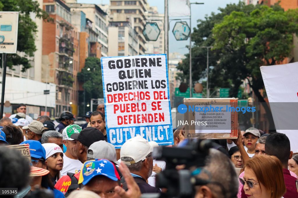 CARACAS, VENEZUELA, OCTOBER 13, 2026: Healthcare workers, teachers and university staff demonstrate in central Caracas to demand higher wages and improved labour benefits. Police block the march towards Miraflores Palace, while a union delegation proceeds to deliver signatures supporting the workers' demands. Photo by Mario Flores / JNA Press. (Photo by Mario Flores/JNA Press via Nexpher Images)