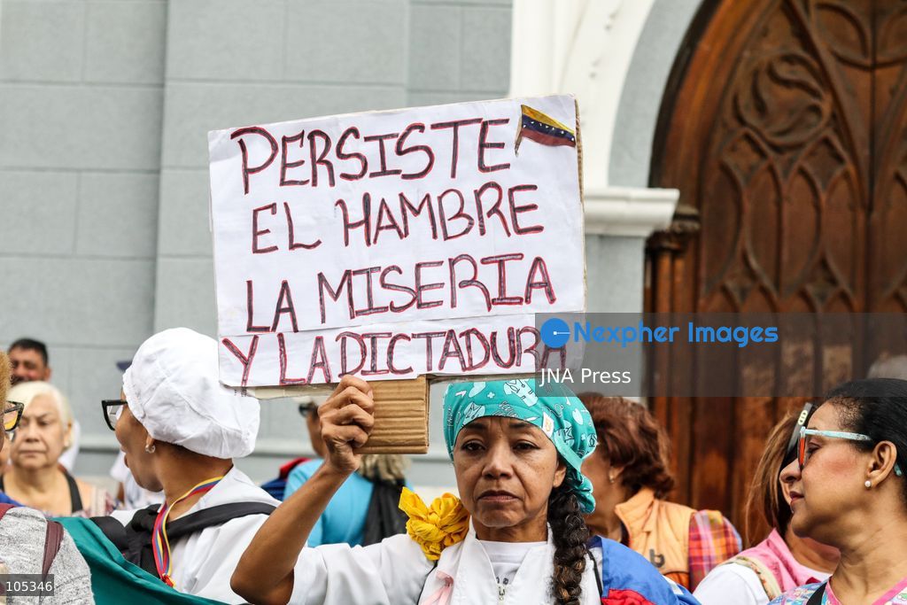 CARACAS, VENEZUELA, OCTOBER 13, 2026: Healthcare workers, teachers and university staff demonstrate in central Caracas to demand higher wages and improved labour benefits. Police block the march towards Miraflores Palace, while a union delegation proceeds to deliver signatures supporting the workers' demands. Photo by Mario Flores / JNA Press. (Photo by Mario Flores/JNA Press via Nexpher Images)