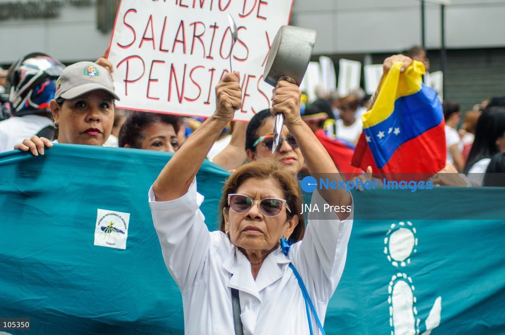 CARACAS, VENEZUELA, OCTOBER 13, 2026: Healthcare workers, teachers and university staff demonstrate in central Caracas to demand higher wages and improved labour benefits. Police block the march towards Miraflores Palace, while a union delegation proceeds to deliver signatures supporting the workers' demands. Photo by Mario Flores / JNA Press. (Photo by Mario Flores/JNA Press via Nexpher Images)