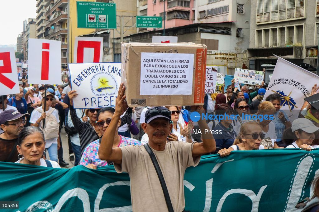 CARACAS, VENEZUELA, OCTOBER 13, 2026: Healthcare workers, teachers and university staff demonstrate in central Caracas to demand higher wages and improved labour benefits. Police block the march towards Miraflores Palace, while a union delegation proceeds to deliver signatures supporting the workers' demands. Photo by Mario Flores / JNA Press. (Photo by Mario Flores/JNA Press via Nexpher Images)