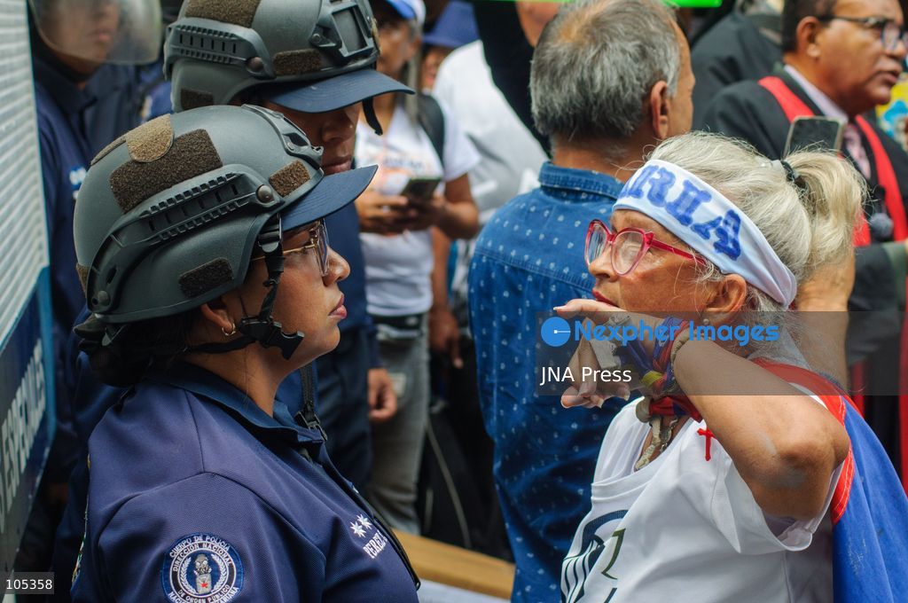 CARACAS, VENEZUELA, OCTOBER 13, 2026: Healthcare workers, teachers and university staff demonstrate in central Caracas to demand higher wages and improved labour benefits. Police block the march towards Miraflores Palace, while a union delegation proceeds to deliver signatures supporting the workers' demands. Photo by Mario Flores / JNA Press. (Photo by Mario Flores/JNA Press via Nexpher Images)