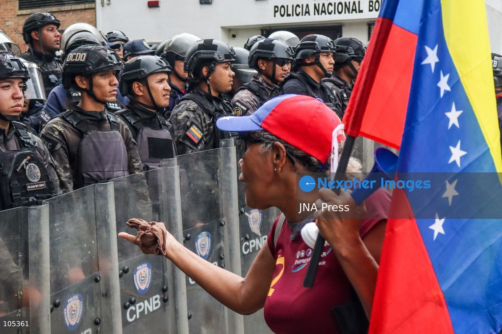 CARACAS, VENEZUELA, OCTOBER 13, 2026: Healthcare workers, teachers and university staff demonstrate in central Caracas to demand higher wages and improved labour benefits. Police block the march towards Miraflores Palace, while a union delegation proceeds to deliver signatures supporting the workers' demands. Photo by Mario Flores / JNA Press. (Photo by Mario Flores/JNA Press via Nexpher Images)
