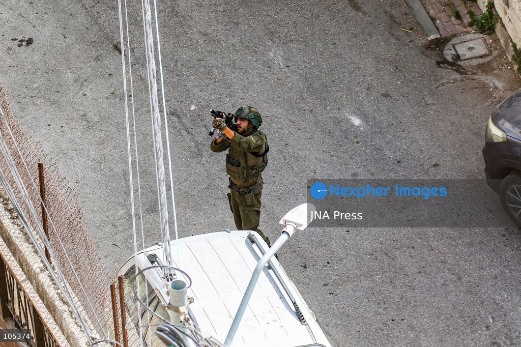 RAMALLAH, WEST BANK, PALESTINE, OCTOBER 13, 2026: Israeli forces conduct a raid in Ramallah in the occupied West Bank. The operation includes a raid on the offices of Addameer Prisoner Support and Human Rights Association. The Palestinian Ministry of Health reported two people wounded, including a 14-year-old boy wounded by Israeli gunfire, while several others were treated for tear gas inhalation. Photo by Salman Mohsen Alkhatib / JNA Press. (Photo by Salman Mohsen Alkhatib/JNA Press via Nexpher Images)