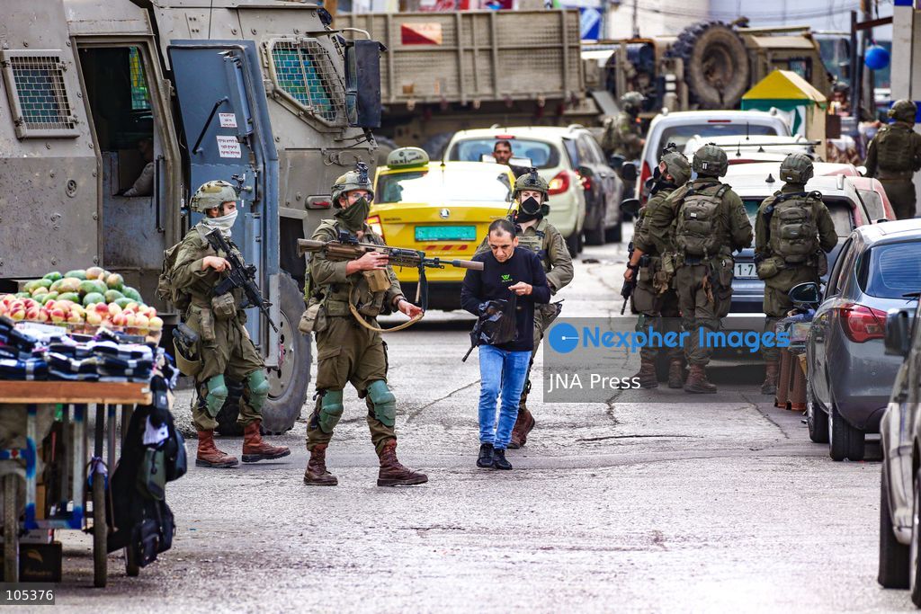 RAMALLAH, WEST BANK, PALESTINE, OCTOBER 13, 2026: Israeli forces conduct a raid in Ramallah in the occupied West Bank. The operation includes a raid on the offices of Addameer Prisoner Support and Human Rights Association. The Palestinian Ministry of Health reported two people wounded, including a 14-year-old boy wounded by Israeli gunfire, while several others were treated for tear gas inhalation. Photo by Salman Mohsen Alkhatib / JNA Press. (Photo by Salman Mohsen Alkhatib/JNA Press via Nexpher Images)