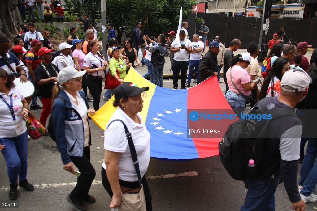 CARACAS, VENEZUELA, OCTOBER 13, 2026: Venezuelan government supporters take part in a march in central Caracas to demand the lifting of economic sanctions. The mobilisation was organised by the ruling United Socialist Party of Venezuela (PSUV). Photo by Moises Quintero / JNA Press. (Photo by Moisés Quintero/JNA Press via Nexpher Images)