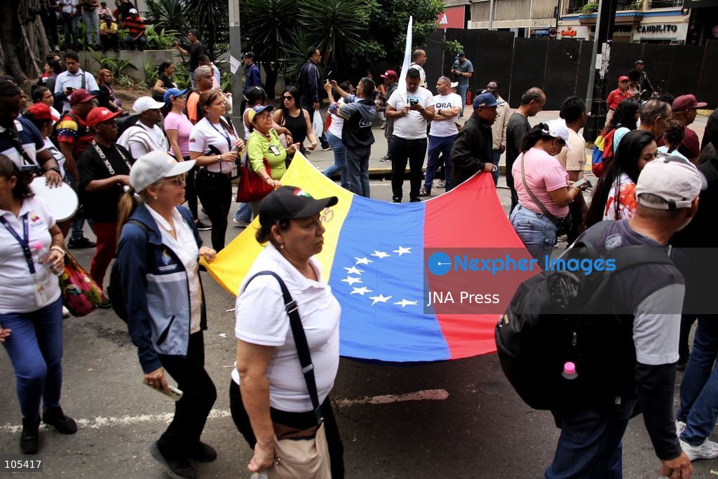 CARACAS, VENEZUELA, OCTOBER 13, 2026: Venezuelan government supporters take part in a march in central Caracas to demand the lifting of economic sanctions. The mobilisation was organised by the ruling United Socialist Party of Venezuela (PSUV). Photo by Moises Quintero / JNA Press. (Photo by Moisés Quintero/JNA Press via Nexpher Images)
