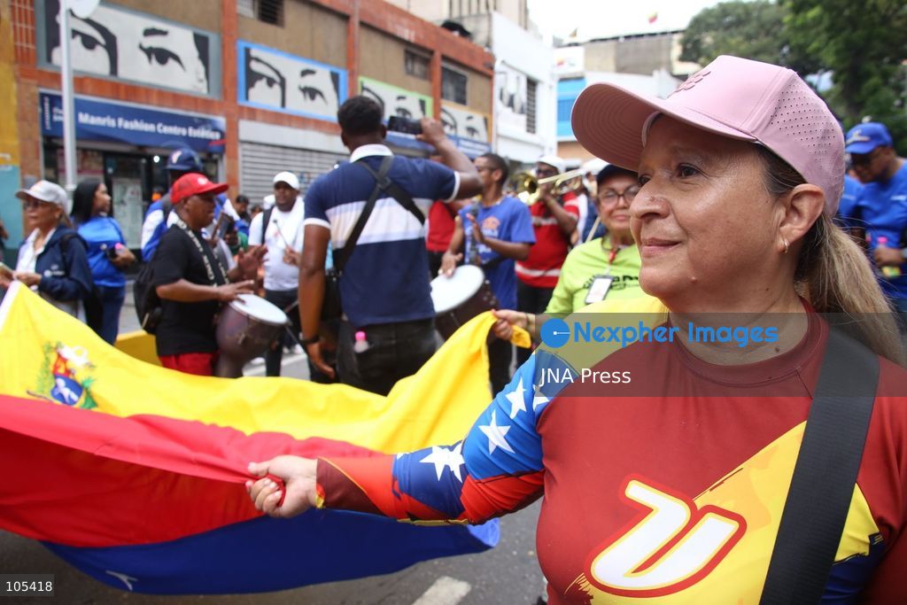 CARACAS, VENEZUELA, OCTOBER 13, 2026: Venezuelan government supporters take part in a march in central Caracas to demand the lifting of economic sanctions. The mobilisation was organised by the ruling United Socialist Party of Venezuela (PSUV). Photo by Moises Quintero / JNA Press. (Photo by Moisés Quintero/JNA Press via Nexpher Images)