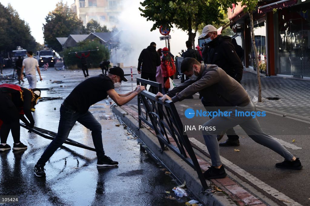 TIRANA, ALBANIA, OCTOBER 13, 2026: Student demonstrators clash with riot police outside the Ministry of Education in Tirana during a protest over university conditions, higher education costs and employment prospects. Police deploy tear gas and water cannons as protesters throw bricks and other objects. Several demonstrators are detained. Photo by Vlasov Sulaj / JNA Press. (Photo by Vlasov Sulaj/JNA Press via Nexpher Images)