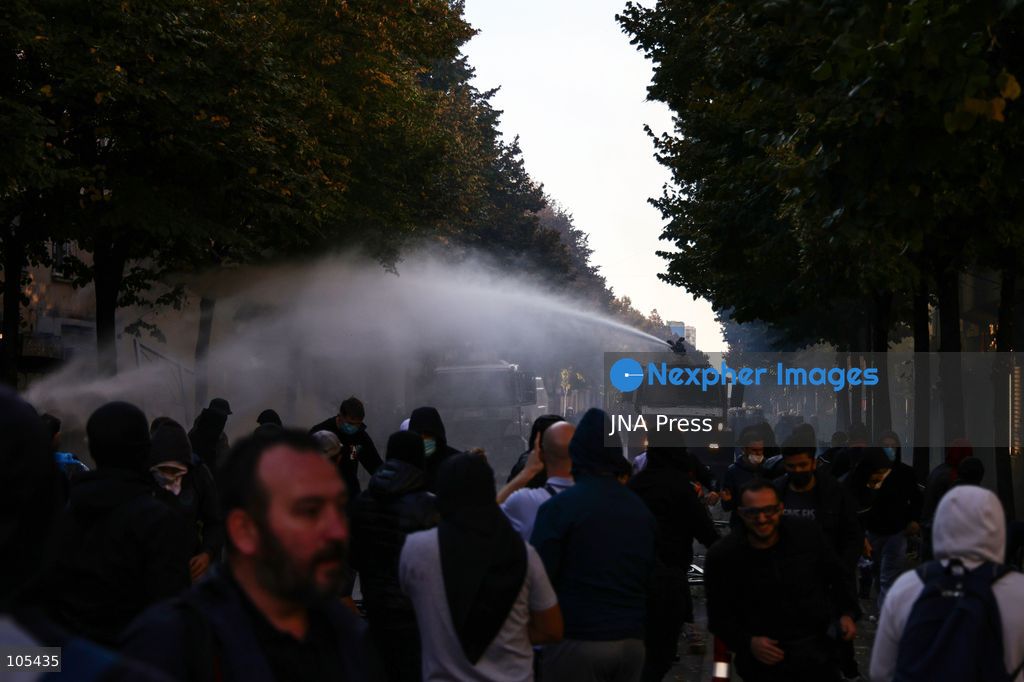 TIRANA, ALBANIA, OCTOBER 13, 2026: Student demonstrators clash with riot police outside the Ministry of Education in Tirana during a protest over university conditions, higher education costs and employment prospects. Police deploy tear gas and water cannons as protesters throw bricks and other objects. Several demonstrators are detained. Photo by Vlasov Sulaj / JNA Press. (Photo by Vlasov Sulaj/JNA Press via Nexpher Images)
