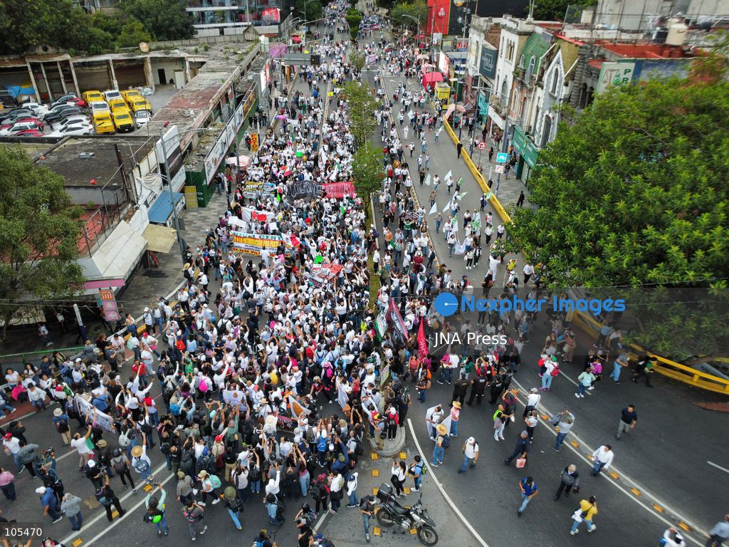 MEXICO CITY, MEXICO, OCTOBER 13, 2026: Workers from the Mexican Social Security Institute (IMSS) march through Mexico City to demand a 10 percent pay increase, improved working conditions and adequate supplies of medicines and medical equipment. The demonstration comes ahead of a union vote on a proposed pay and benefits package. Photo by Carlos Santiago / JNA Press. (Photo by Carlos Santiago/JNA Press via Nexpher Images)