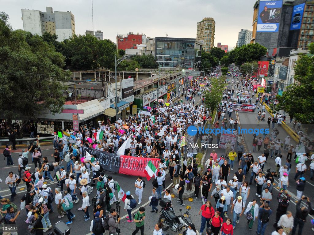 MEXICO CITY, MEXICO, OCTOBER 13, 2026: Workers from the Mexican Social Security Institute (IMSS) march through Mexico City to demand a 10 percent pay increase, improved working conditions and adequate supplies of medicines and medical equipment. The demonstration comes ahead of a union vote on a proposed pay and benefits package. Photo by Carlos Santiago / JNA Press. (Photo by Carlos Santiago/JNA Press via Nexpher Images)