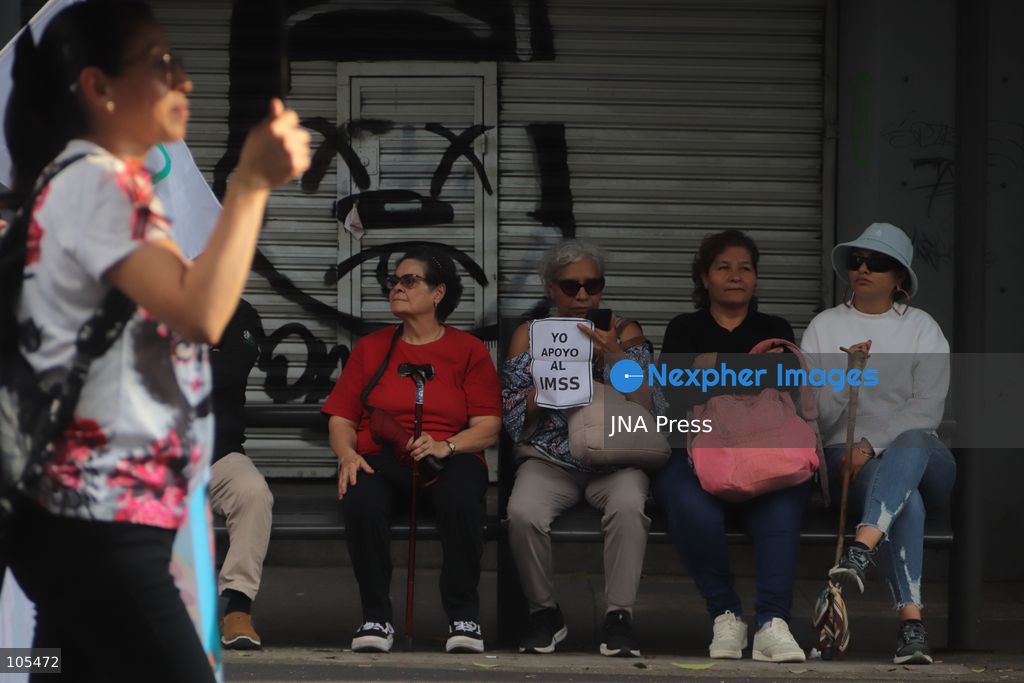 MEXICO CITY, MEXICO, OCTOBER 13, 2026: Workers from the Mexican Social Security Institute (IMSS) march through Mexico City to demand a 10 percent pay increase, improved working conditions and adequate supplies of medicines and medical equipment. The demonstration comes ahead of a union vote on a proposed pay and benefits package. Photo by Carlos Santiago / JNA Press. (Photo by Carlos Santiago/JNA Press via Nexpher Images)