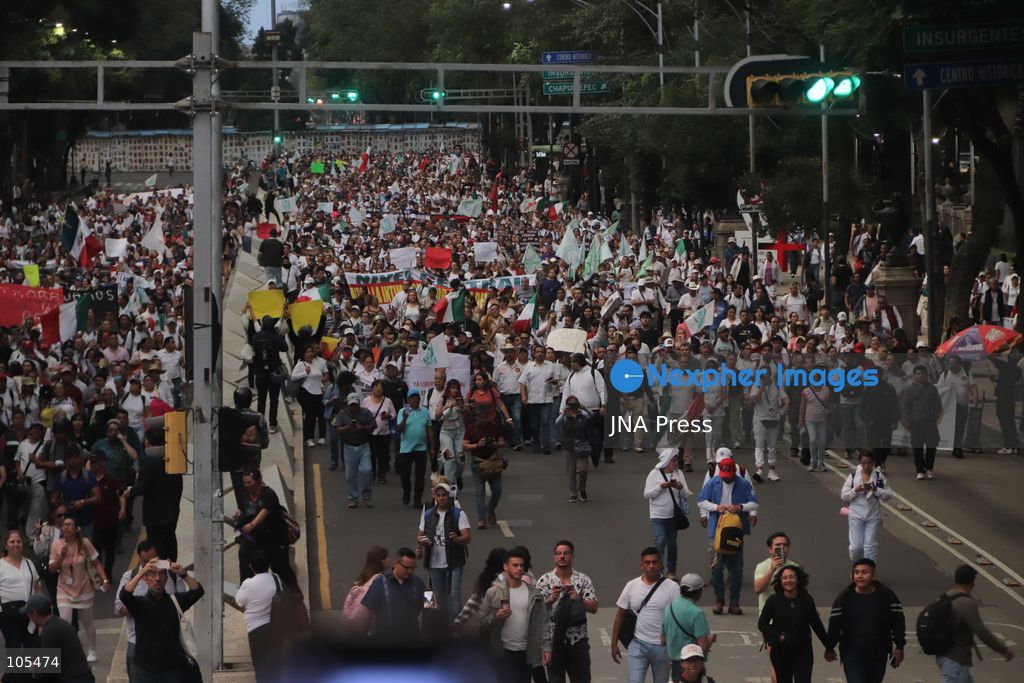 MEXICO CITY, MEXICO, OCTOBER 13, 2026: Workers from the Mexican Social Security Institute (IMSS) march through Mexico City to demand a 10 percent pay increase, improved working conditions and adequate supplies of medicines and medical equipment. The demonstration comes ahead of a union vote on a proposed pay and benefits package. Photo by Carlos Santiago / JNA Press. (Photo by Carlos Santiago/JNA Press via Nexpher Images)