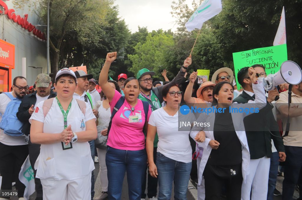 MEXICO CITY, MEXICO, OCTOBER 13, 2026: Workers from the Mexican Social Security Institute (IMSS) march through Mexico City to demand a 10 percent pay increase, improved working conditions and adequate supplies of medicines and medical equipment. The demonstration comes ahead of a union vote on a proposed pay and benefits package. Photo by Carlos Santiago / JNA Press. (Photo by Carlos Santiago/JNA Press via Nexpher Images)