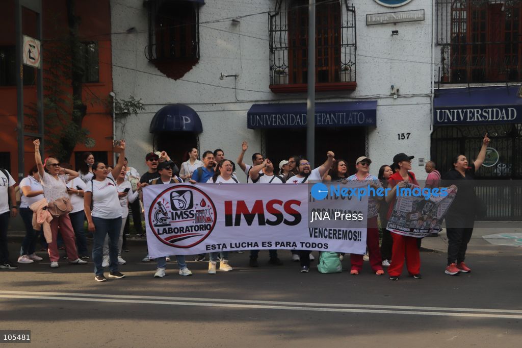 MEXICO CITY, MEXICO, OCTOBER 13, 2026: Workers from the Mexican Social Security Institute (IMSS) march through Mexico City to demand a 10 percent pay increase, improved working conditions and adequate supplies of medicines and medical equipment. The demonstration comes ahead of a union vote on a proposed pay and benefits package. Photo by Carlos Santiago / JNA Press. (Photo by Carlos Santiago/JNA Press via Nexpher Images)