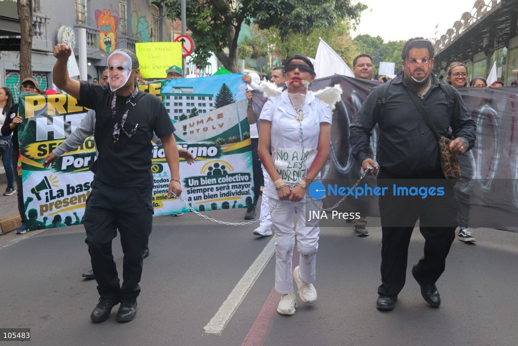 MEXICO CITY, MEXICO, OCTOBER 13, 2026: Workers from the Mexican Social Security Institute (IMSS) march through Mexico City to demand a 10 percent pay increase, improved working conditions and adequate supplies of medicines and medical equipment. The demonstration comes ahead of a union vote on a proposed pay and benefits package. Photo by Carlos Santiago / JNA Press. (Photo by Carlos Santiago/JNA Press via Nexpher Images)