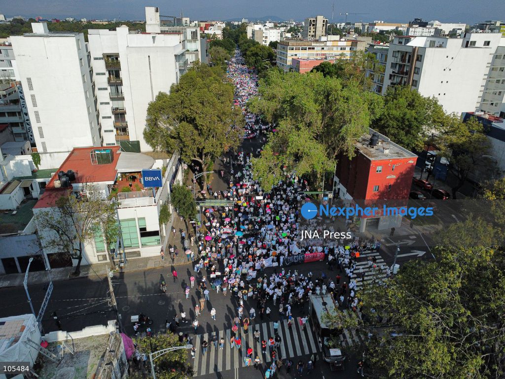 MEXICO CITY, MEXICO, OCTOBER 13, 2026: Workers from the Mexican Social Security Institute (IMSS) march through Mexico City to demand a 10 percent pay increase, improved working conditions and adequate supplies of medicines and medical equipment. The demonstration comes ahead of a union vote on a proposed pay and benefits package. Photo by Carlos Santiago / JNA Press. (Photo by Carlos Santiago/JNA Press via Nexpher Images)