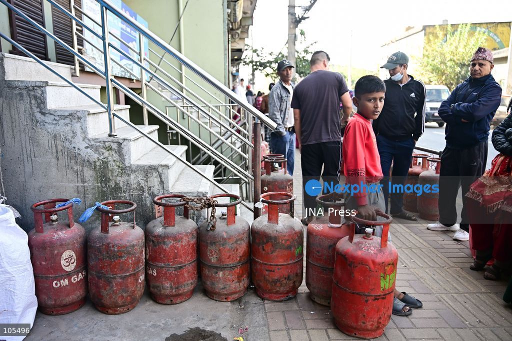 KATHMANDU, NEPAL, OCTOBER 14, 2026: Consumers queue with empty liquefied petroleum gas (LPG) cylinders at a distribution centre in Kathmandu amid a cooking gas shortage during the Dashain festival. Floods and landslides have disrupted transport routes supplying the capital, compounding difficulties in obtaining gas for household cooking and festival preparations. Photo by Safal Prakash Shrestha / JNA Press. (Photo by Safal Prakash Shrestha/JNA Press via Nexpher Images)