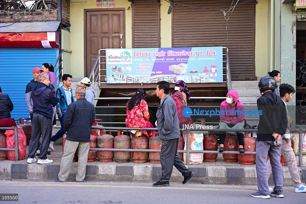 KATHMANDU, NEPAL, OCTOBER 14, 2026: Consumers queue with empty liquefied petroleum gas (LPG) cylinders at a distribution centre in Kathmandu amid a cooking gas shortage during the Dashain festival. Floods and landslides have disrupted transport routes supplying the capital, compounding difficulties in obtaining gas for household cooking and festival preparations. Photo by Safal Prakash Shrestha / JNA Press. (Photo by Safal Prakash Shrestha/JNA Press via Nexpher Images)