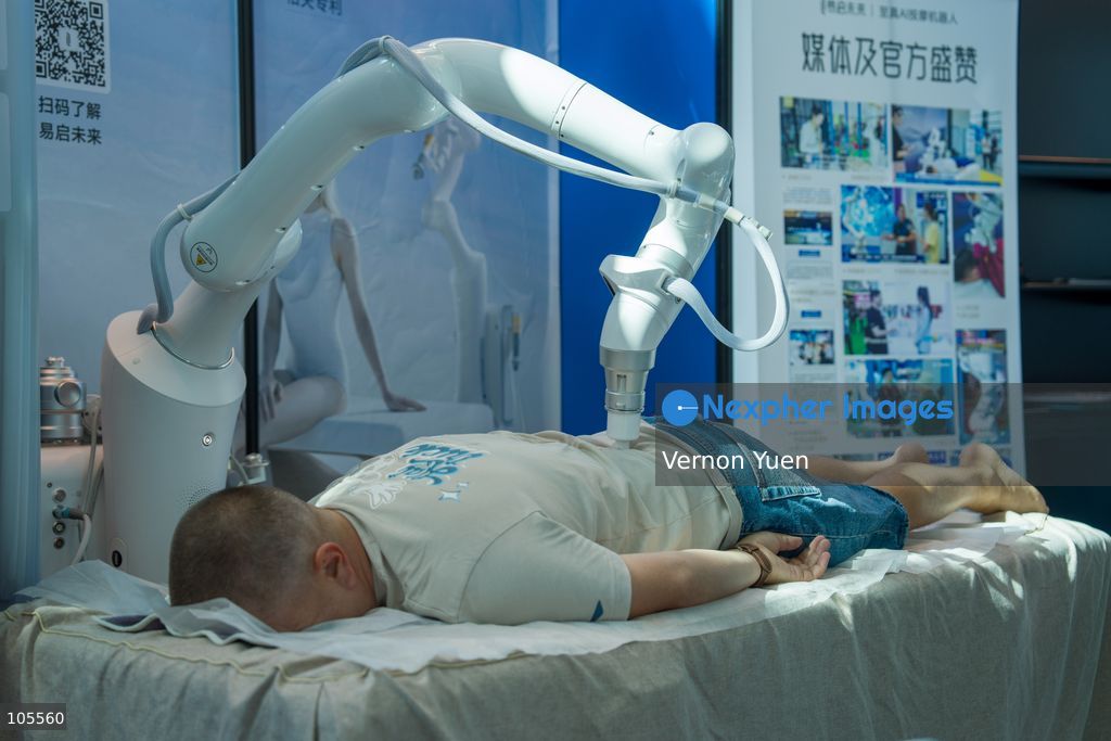 A message robot massaging a man at the Hong Kong Electronics Fair on October 14, 2026 in Hong Kong. (Photo by Vernon Yuen/Nexpher Images)