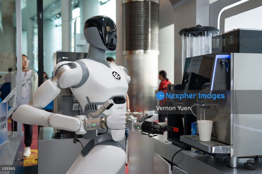 A robot serving a coffee at the Hong Kong Electronics Fair on October 14, 2026 in Hong Kong. (Photo by Vernon Yuen/Nexpher Images)
