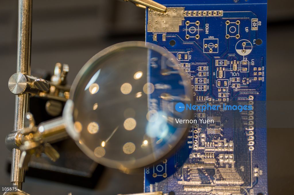A magnifying glass looking at a PCB board at the Hong Kong Electronics Fair on October 14, 2026 in Hong Kong. (Photo by Vernon Yuen/Nexpher Images)