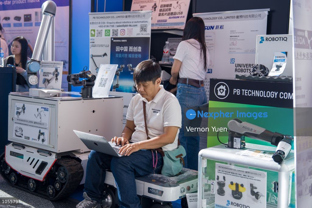 A man working on a laptop at the Hong Kong Electronics Fair on October 14, 2026 in Hong Kong. (Photo by Vernon Yuen/Nexpher Images)